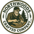 Logo of Northwoods Crafted Company with a man working with wood and trees in the background.